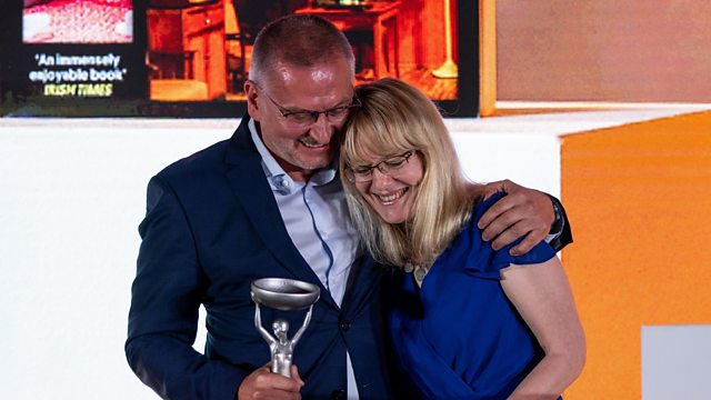 Georgi Gospodinov and Angela Rodel holding the International Booker Prize trophy at the 2023 awards ceremony